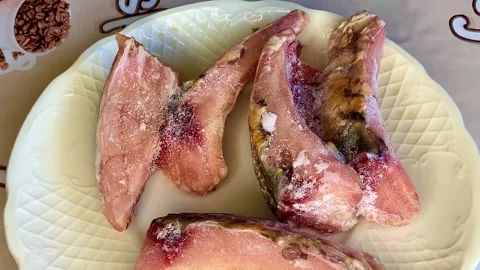 Thawed raw fish prepared for frying on a plate. Stock-Footage 252561451