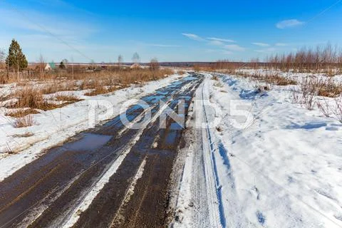 Thawed road at spring Stock Photos