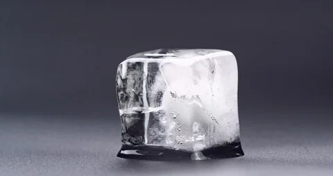 ice cube melting black and white