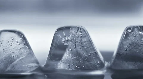 Thawing ice cube close-up timelapse 4k (4096x2304) Stock Footage 62925432