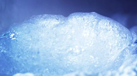 Thawing ice in cyan light close-up timelapse 4k (4096x2304) Stock Footage 50462088