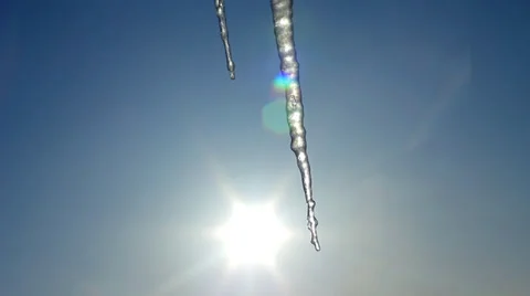 Thawing Spring Icicles on Blue Sky with Sun Shining background HD 動画素材 34692267