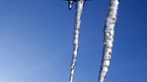 Thawing Spring Icicles Dripping and Splashing against Blue Sky HD Stock Footage 35110177