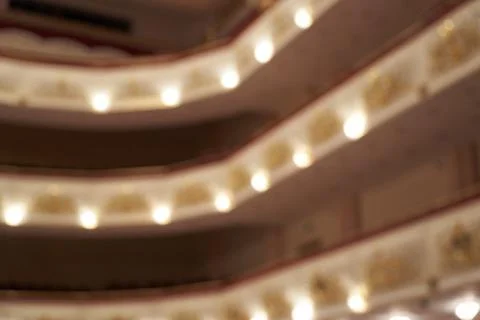 Theater, blurred background of lights inside the hall, background Stock Photos