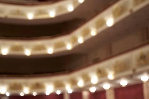 Theater, blurred background of lights inside the hall, background Stock Photos