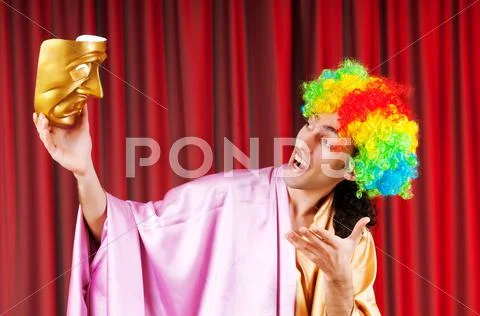 Theater concept with masked actor Stock Photos