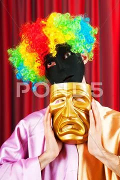 Theater concept with masked actor Stock Photos