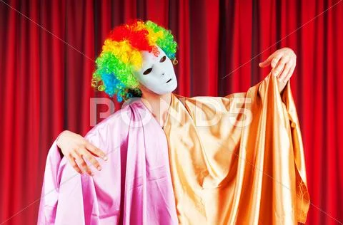 Theater concept with masked actor Stock Photos