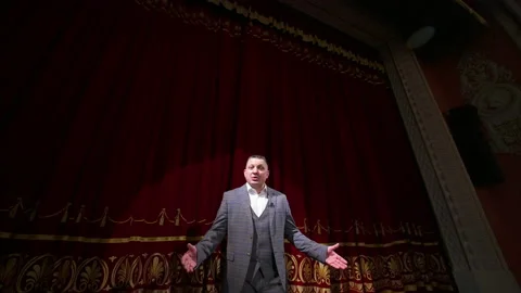 Theater host on red curtains background. Video stock 147087600