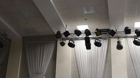 Theatrical lighting mounted on the wall creates a muffled light Stock Footage 111145107