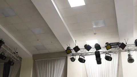 Theatrical lighting mounted on the wall creates a muffled light Stock Footage 111145163