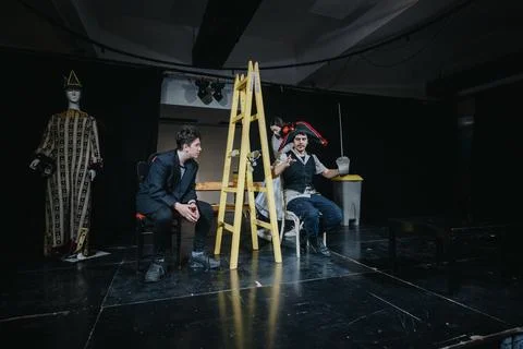 Theatrical performance with actors and dramatic costumes featuring a unique set Stock Photos