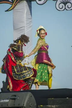 A theatrical scene on stage between a dancer and a warrior Stock Photos