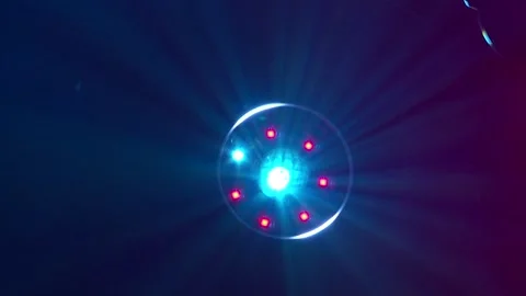 A theatrical spotlight with multicolored rays in operation Video stock 287595697