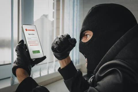 Theft of personal data. Hacking the city. A bandit in the office picks up a.. Stock Photos