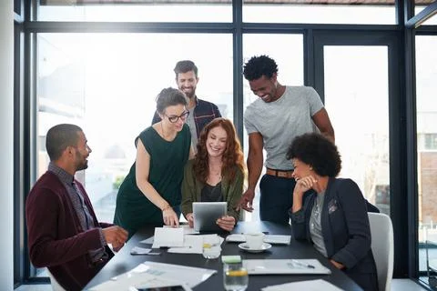 Their dynamic approach is what makes them so successful. a group of young Stock Photos