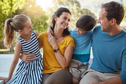 Their family bond grows everyday. a family of four spending time together in Stock Photos