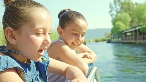 Their happy daughters are on the excursion boat in Akyaka river. 動画素材 167554176