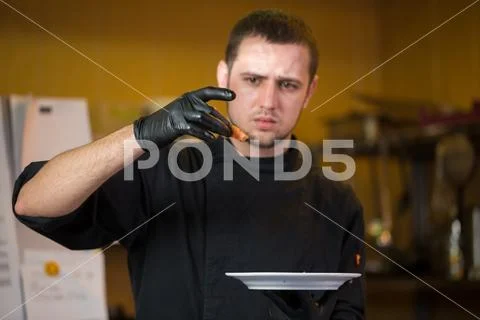 Theme cooking is profession of cooking. Portrait of Caucasian man in restaurant Stock Photos