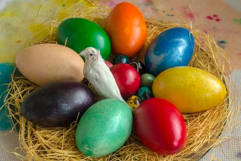 Theme Easter. Multicolored eggs of quail, hen and duck on straw. Stock Photos