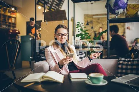 Theme modern profession female blogger. Caucasian woman with glasses and jacket Stock Photos
