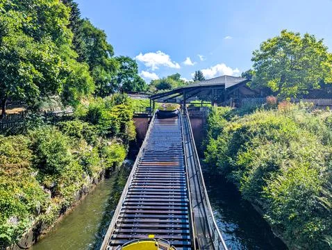 Theme Park River Rapids Ride Climbing Lift Hill On Sunny Summer Day Stock Photos