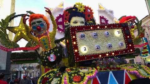A themed float, with flashing lights moving down the street parade during the Stock Footage 303258136