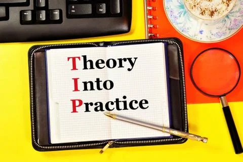 Theory into practice. Text label in the planning Notepad. Stock Photos