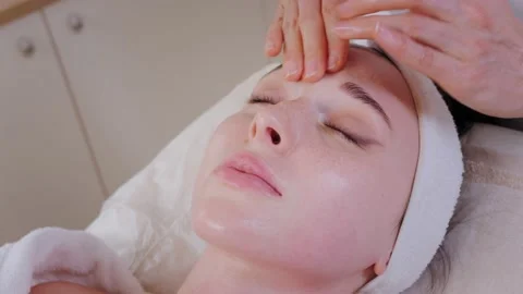 Therapist cosmetologist performs massage procedure to client Stock-Footage 196061982