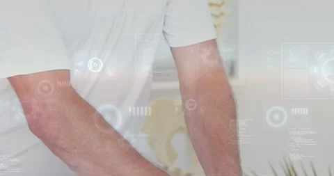 Therapist pressing patient neck on table for spine exam with HUD overlays Stock Footage 334315902