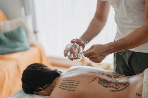 Therapist warming up inside a suction cup Stock Photos