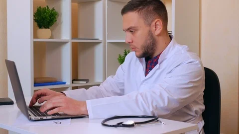 Therapist works on computer Stock Footage 112080321
