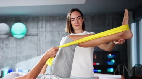Therapy Band Exercise. Therapeutic Physio Rehab Stock Footage 290172406