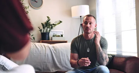 Therapy, discussion and man with eft tapping on sofa for anxiety, mental health Stock Footage 331420641