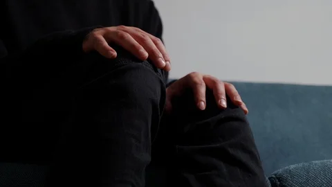 Therapy session: close up on nervous, anxious man's hands Stock Footage