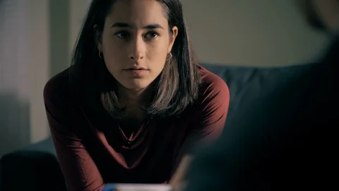 Therapy session. Depressed upset young woman talking with her  Psychologist Video stock 100035720