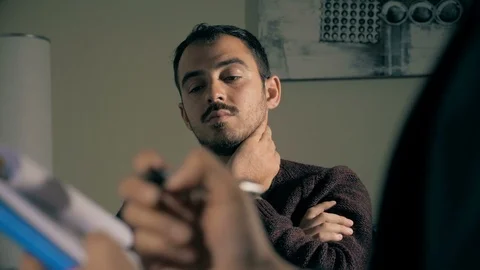 Therapy session. Sad depressed man talking with the Psychologist Stock-Footage 100036809