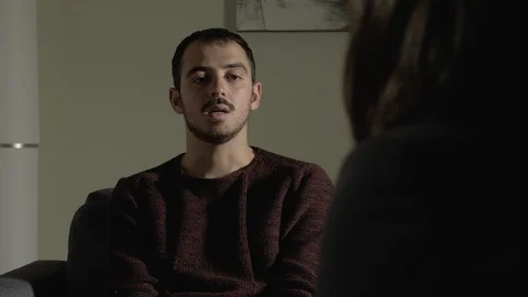 Therapy session.Frustrated sad man talking with his psychologist Stockbeeldmateriaal 108387445