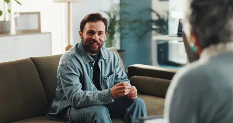 Therapy, talking and happy man with therapist in office for consulting, advice Video stock 310230316
