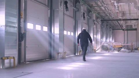 There are automatic gates at a large warehouse.  Video stock 239166445