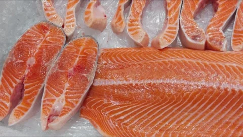There are chopped pieces of red fish on the display case with ice. Stock Footage 288117721