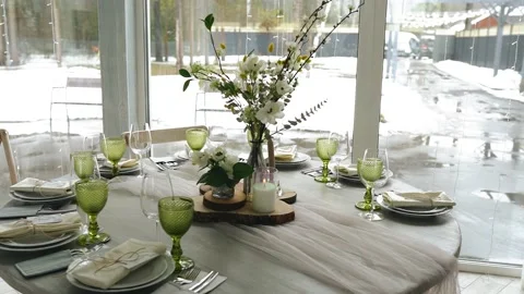 There are clean plates and glasses on the table at the event Stock Footage 156939418
