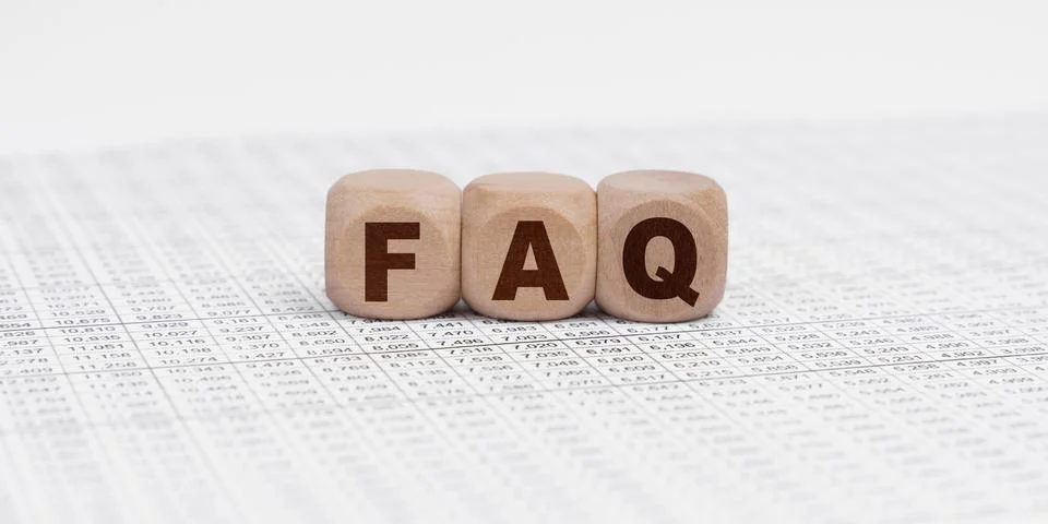 There are cubes on the reporting documents with the inscription - FAQ Stock Photos