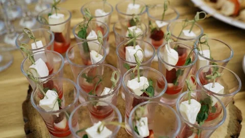There are delicious canapes in the small stacks. Treats at the event Stock Footage 302111505
