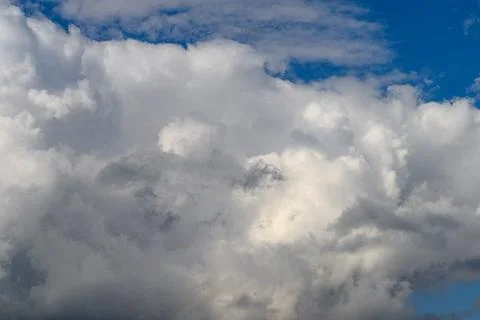There are dramatic clouds beautifully contrasting against a bright blue sky abov Foto stock
