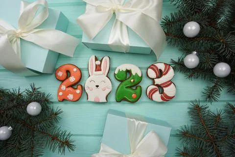 There are gingerbread cookies on the table in the form of numbers 2023. Stock Photos