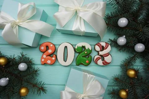 There are gingerbread cookies on the table in the form of numbers 2023. Stock Photos