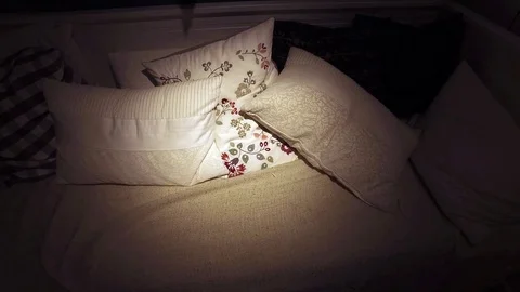 There are a lot of pillows on the couch Stock Footage 79244472