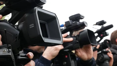 There are many camcorders whose lenses are aimed forward and upward. Video stock 303648889