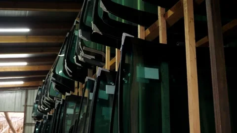 There are many different glasses for the car on the shelves of the car shop. Stock Footage 312441192